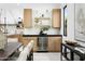 Modern bar area features stylish cabinetry, shelving, and a beverage cooler at 7774 E San Fernando Dr, Scottsdale, AZ 85255