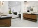 Elegant bathroom boasts a dual vanity and leads to a light-filled bedroom at 7774 E San Fernando Dr, Scottsdale, AZ 85255