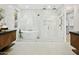 Bright bathroom with a luxurious soaking tub, glass shower, and modern fixtures at 7774 E San Fernando Dr, Scottsdale, AZ 85255