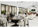 Open floor plan: dining room adjacent to the living area, and backyard access with sliding glass doors at 7774 E San Fernando Dr, Scottsdale, AZ 85255