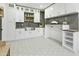 Well-organized laundry room with ample cabinet space, butcher block countertops and stylish tile flooring at 7774 E San Fernando Dr, Scottsdale, AZ 85255