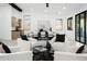 Bright living room with modern furnishings, views into the dining and kitchen areas at 7774 E San Fernando Dr, Scottsdale, AZ 85255