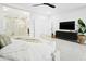 Bright main bedroom with ensuite bath featuring a luxurious soaking tub and glass-enclosed shower and modern furnishings at 7774 E San Fernando Dr, Scottsdale, AZ 85255