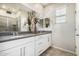 Bathroom featuring a double sink vanity, decorative accents, and walk-in shower at 778 W Lowell Dr, San Tan Valley, AZ 85140