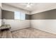 Spacious bedroom featuring carpet, a ceiling fan, and a contrasting accent wall at 778 W Lowell Dr, San Tan Valley, AZ 85140