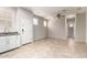 Open-concept living area featuring tile floors, white door, and plenty of natural light at 778 W Lowell Dr, San Tan Valley, AZ 85140