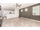 A spacious living room with tile floors, neutral tones, and ample natural light at 778 W Lowell Dr, San Tan Valley, AZ 85140