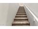 Carpeted staircase with white banister leading to the upper level of the home at 778 W Lowell Dr, San Tan Valley, AZ 85140