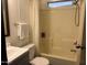 Well-maintained bathroom with tub and shower combo, sink and neutral decor at 9302 E Broadway Rd # 129, Mesa, AZ 85208