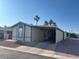 Manufactured home featuring covered parking at 9302 E Broadway Rd # 129, Mesa, AZ 85208
