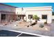 Commercial building featuring a beautiful fountain, desert landscaping, and inviting entrance at 9302 E Broadway Rd # 129, Mesa, AZ 85208