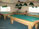 Spacious game room featuring multiple billiard tables and ceiling fans for optimal comfort at 9302 E Broadway Rd # 129, Mesa, AZ 85208