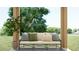 Cozy outdoor patio area featuring comfortable seating, throw pillows, and potted plants at 9534 W Catalina Dr, Phoenix, AZ 85037