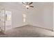 Bedroom featuring neutral carpet and double French doors at 1021 S Greenfield Rd # 1211, Mesa, AZ 85206