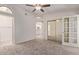 Bedroom featuring neutral carpet, ceiling fan, en suite bath and closet at 1021 S Greenfield Rd # 1211, Mesa, AZ 85206