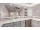 Kitchen featuring granite counters, stainless appliances, light gray cabinets, and a breakfast bar at 1021 S Greenfield Rd # 1211, Mesa, AZ 85206
