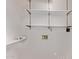 The laundry room offers convenient storage with built-in shelving and utility connections at 1021 S Greenfield Rd # 1211, Mesa, AZ 85206