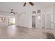 Inviting living room featuring ample natural light, wood flooring, and neutral-colored walls at 1021 S Greenfield Rd # 1211, Mesa, AZ 85206