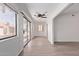 Bright living room with wood floors, large windows, and a sliding glass door to the patio at 1021 S Greenfield Rd # 1211, Mesa, AZ 85206