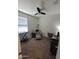 Well-lit bedroom showcases a cozy layout with a chair, keyboard and desk area at 1133 E Viola Ct, Casa Grande, AZ 85122