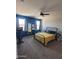 Comfortable bedroom with two windows, neutral carpet, and furniture at 1133 E Viola Ct, Casa Grande, AZ 85122