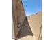 Narrow side yard with rock landscaping, block fence and partial roof overhang at 1133 E Viola Ct, Casa Grande, AZ 85122