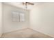 Bedroom with window and neutral carpet at 11338 E Contessa St, Mesa, AZ 85207