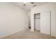 Bright bedroom with closet and neutral carpet at 11338 E Contessa St, Mesa, AZ 85207