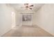Neutral bedroom with carpet, ceiling fan, and a window with natural light at 11338 E Contessa St, Mesa, AZ 85207