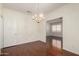 Formal dining area with wood floors and elegant lighting at 11338 E Contessa St, Mesa, AZ 85207