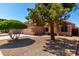 A well-maintained single-Gathering home featuring desert landscaping and mature trees at 11338 E Contessa St, Mesa, AZ 85207