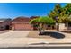 Charming single-Gathering home featuring a two-car garage and desert landscaping at 11338 E Contessa St, Mesa, AZ 85207