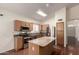 Well-appointed kitchen with granite countertops, stainless steel appliances, and a central island at 11338 E Contessa St, Mesa, AZ 85207