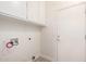 Laundry room with overhead cabinets and tile flooring at 11338 E Contessa St, Mesa, AZ 85207