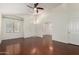 Bright living room with hardwood floors, and a ceiling fan at 11338 E Contessa St, Mesa, AZ 85207