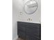 Modern bathroom with a sleek vanity and contemporary round mirror at 122 S Hardy Dr # 62, Tempe, AZ 85281