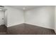 A simple bedroom with dark floors, white trim, and recessed lights at 122 S Hardy Dr # 62, Tempe, AZ 85281