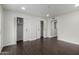 Bedroom with dark floors and white trim, featuring a closet and recessed lights at 122 S Hardy Dr # 62, Tempe, AZ 85281
