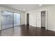 Bright bedroom featuring recessed lights, dark floors, sliding doors, and a closet at 122 S Hardy Dr # 62, Tempe, AZ 85281