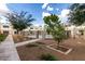 Inviting community pool surrounded by mature trees and a secure wrought iron fence at 122 S Hardy Dr # 62, Tempe, AZ 85281