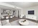 Bright living room featuring an open floor plan with a modern kitchen and stylish furniture at 122 S Hardy Dr # 62, Tempe, AZ 85281