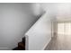 Clean stairway with wood stairs, white walls and railing, and a landing window at 122 S Hardy Dr # 62, Tempe, AZ 85281