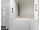 A built-in storage unit in the hall has white paint and dark accents at 122 S Hardy Dr # 62, Tempe, AZ 85281