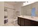 Bright bathroom featuring double sinks, tile floor, and shower-tub combo at 1367 S Country Club S Dr # 1125, Mesa, AZ 85210