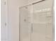 Bathroom with a large shower featuring a glass door and tiled walls and floors at 1367 S Country Club S Dr # 1125, Mesa, AZ 85210