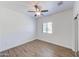 Bedroom with wood look floors, ceiling fan, closet, and a window with blinds at 1367 S Country Club S Dr # 1125, Mesa, AZ 85210
