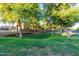 Well-maintained community green space with mature shade trees at 1367 S Country Club S Dr # 1125, Mesa, AZ 85210