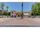 Gated community entrance with lush landscaping and a welcoming design at 1367 S Country Club S Dr # 1125, Mesa, AZ 85210
