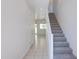 Bright entryway featuring tile flooring, staircase, and view to living area at 1367 S Country Club S Dr # 1125, Mesa, AZ 85210