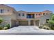 Exterior of property featuring three-car garage and second story balcony at 1367 S Country Club S Dr # 1125, Mesa, AZ 85210